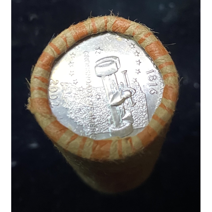 Rolled coins with visible quarter showing 2002, 1816