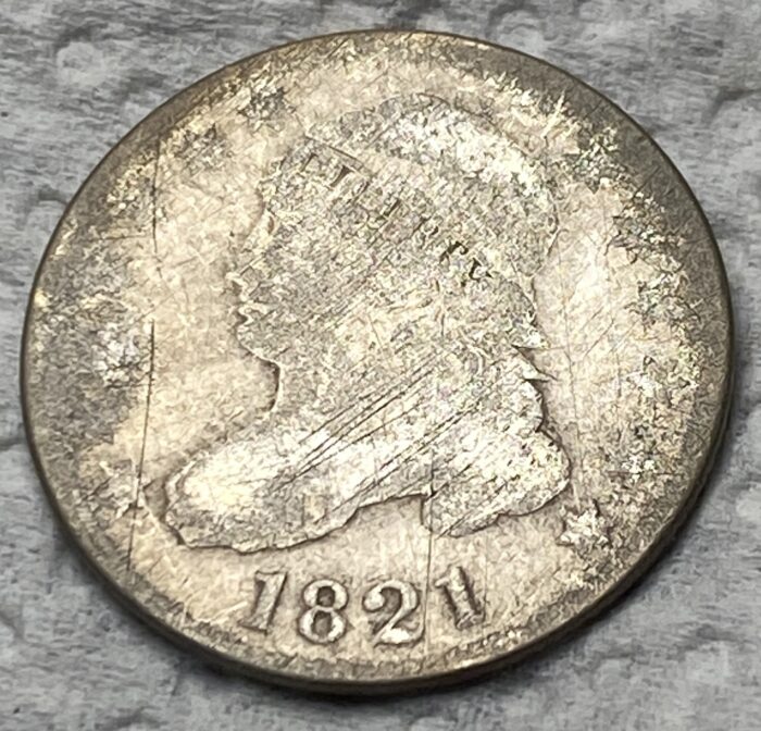 1821 vintage coin with worn features