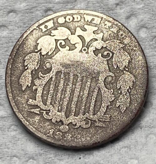 Close-up of 1867 Shield Nickel coin