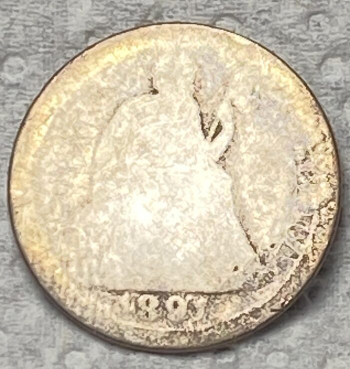 Old coin from 1905, worn design visible.