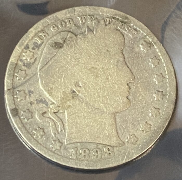 1898 Liberty Head coin with stars and profile face.