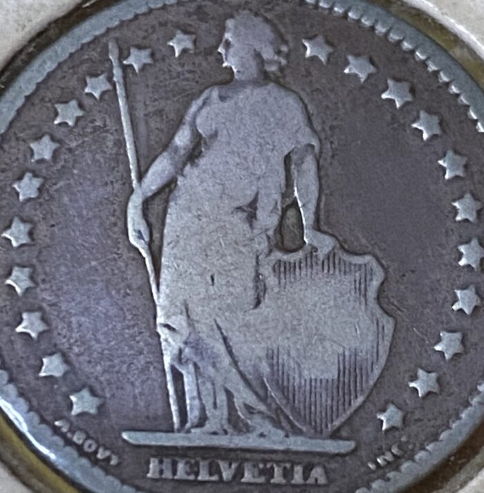 Swiss coin featuring Helvetia and shield