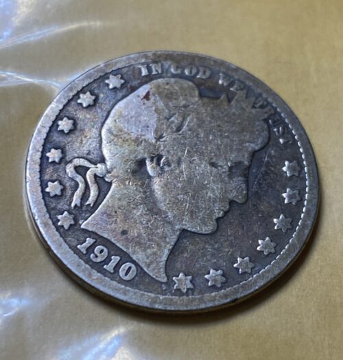 1910 silver coin with profile portrait design.