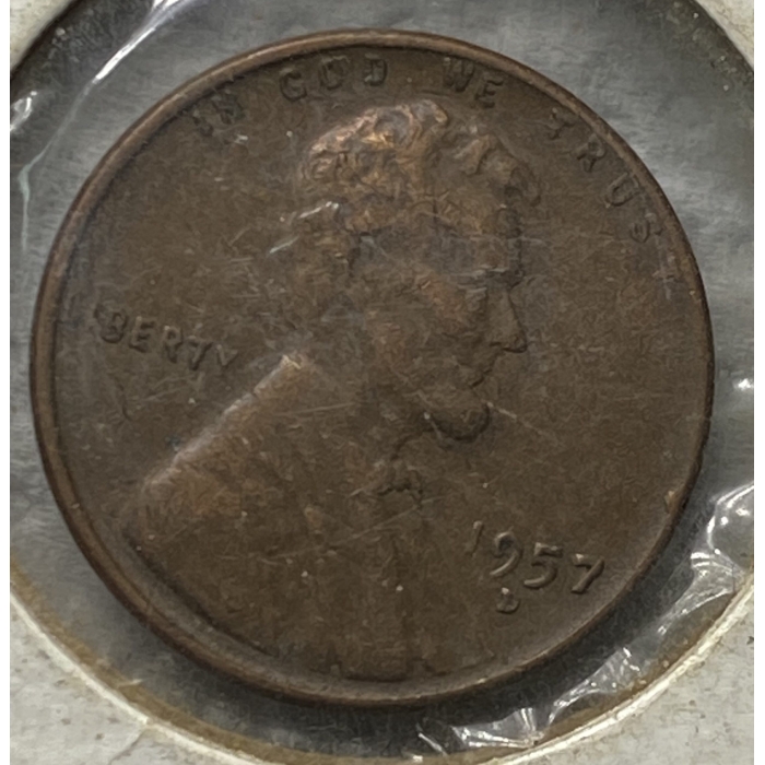 1957 Lincoln penny in a plastic casing.