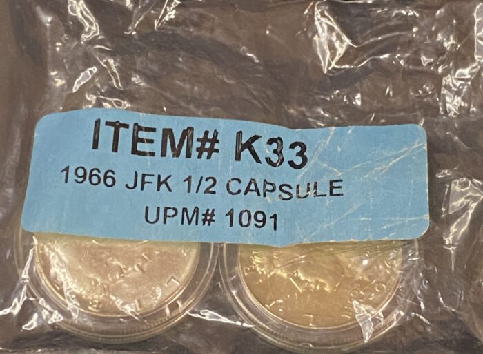 1966 JFK half dollar coins in capsule