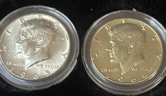 Two Kennedy half dollar coins, 1965 and 1966.