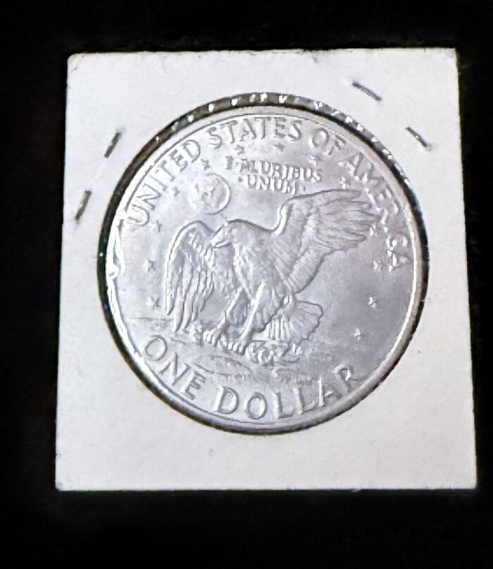 Silver United States one dollar coin front view.