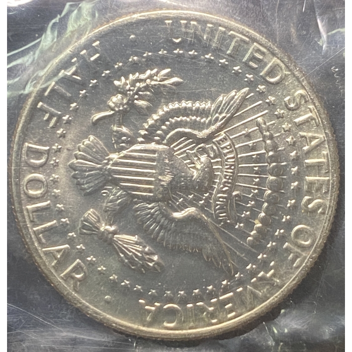 Reverse side of a US dollar coin featuring eagle.