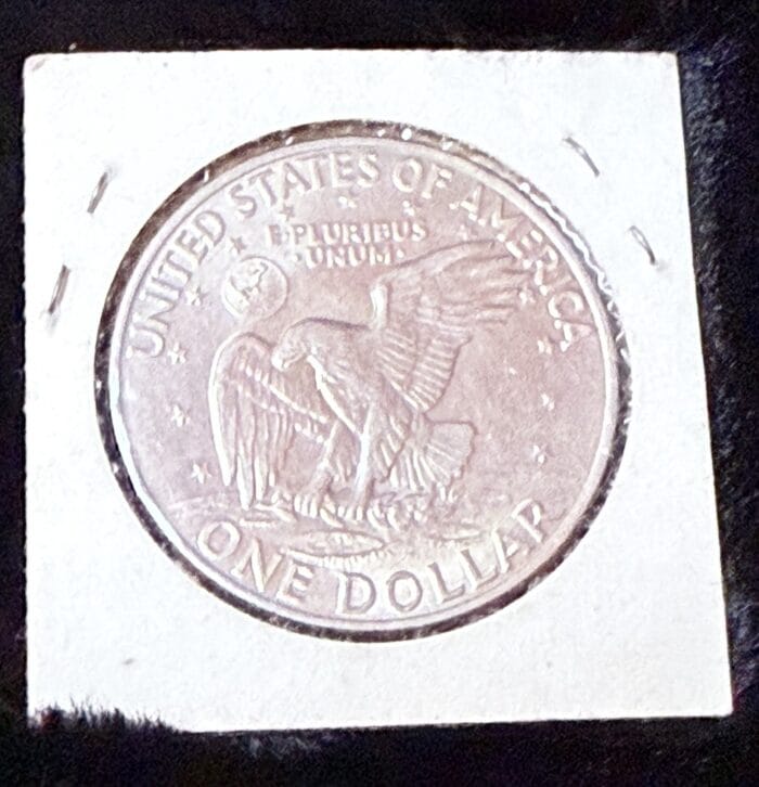 US silver dollar coin with eagle design.