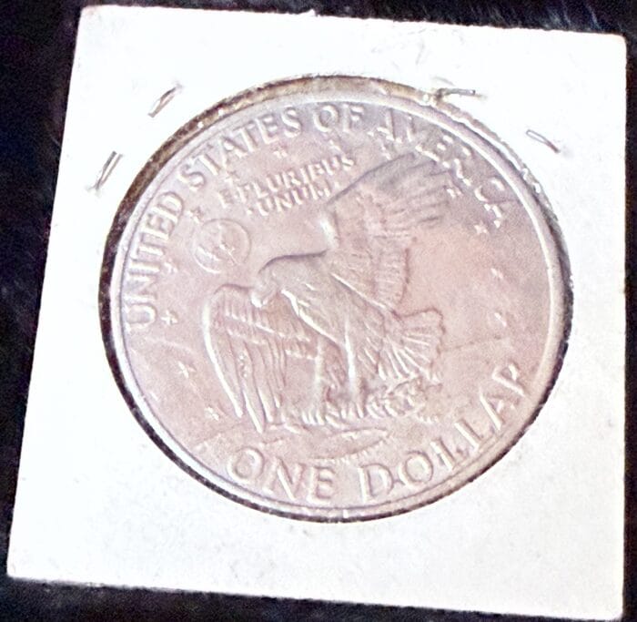 United States one-dollar coin with eagle design.