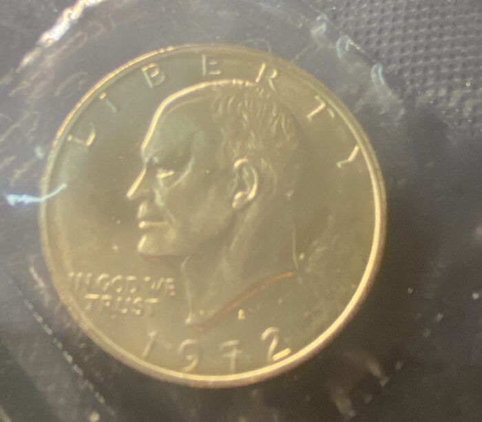 1972 Eisenhower dollar coin, Liberty inscription.