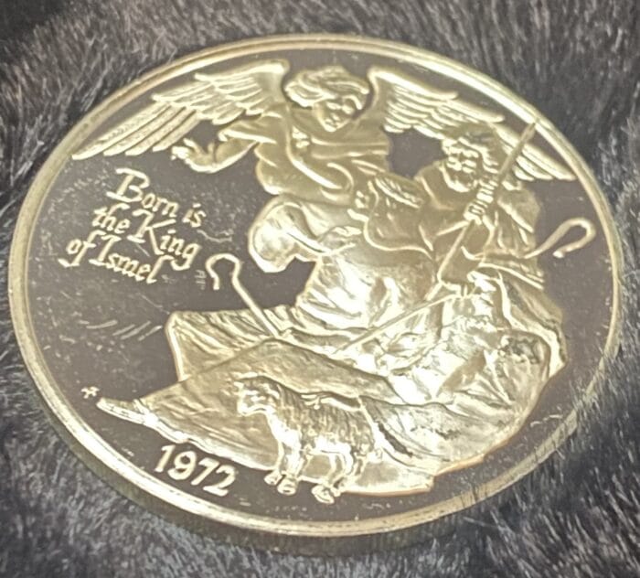 1972 coin with angelic figures and sheep