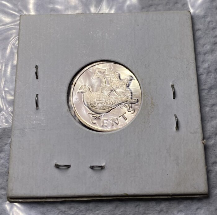 Five cent coin with bird design in holder.