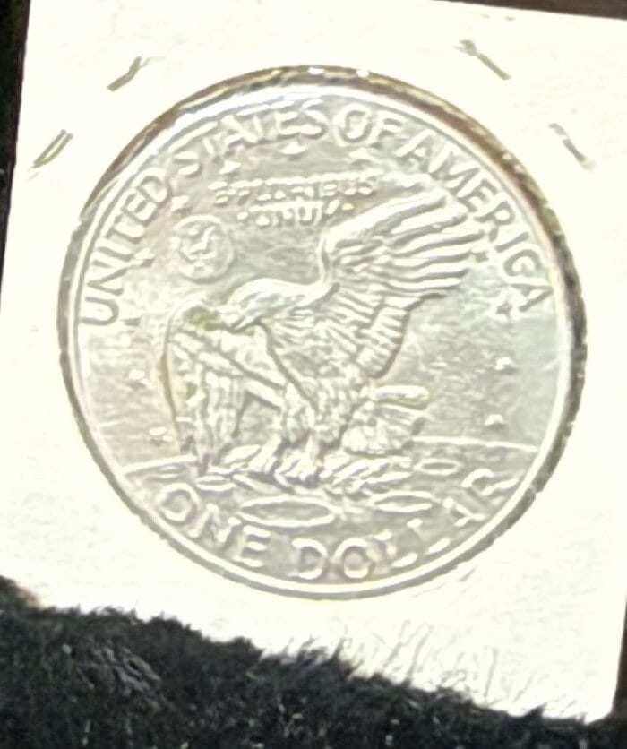 Silver U.S. dollar coin with eagle design