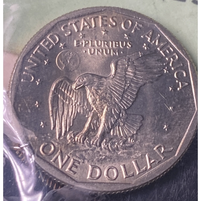 United States one dollar coin with eagle design.