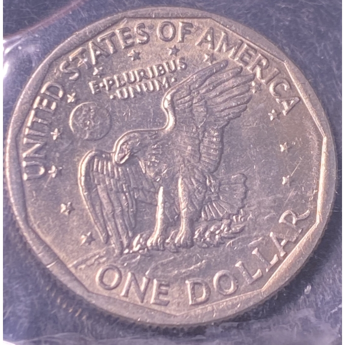United States one dollar coin with eagle design.