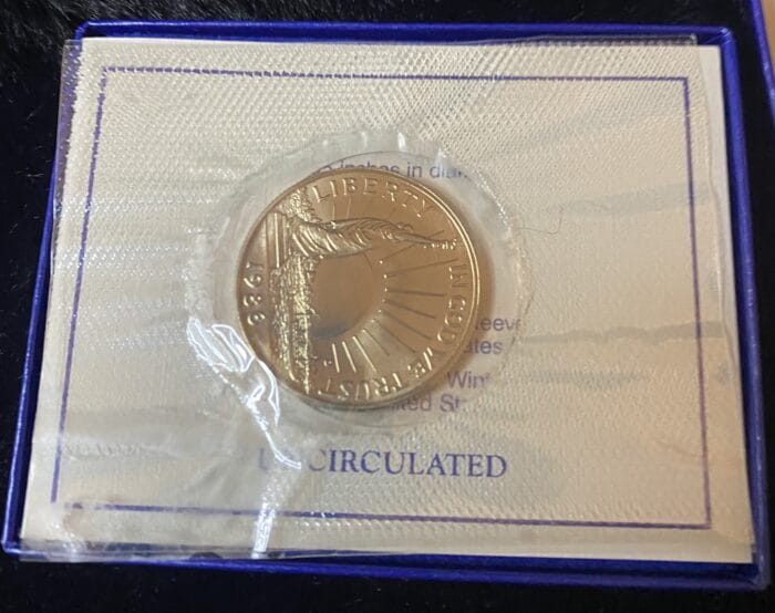 1986 Liberty dollar coin in original packaging