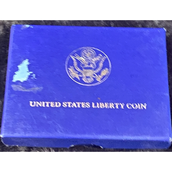 Blue box with United States Liberty Coin logo.
