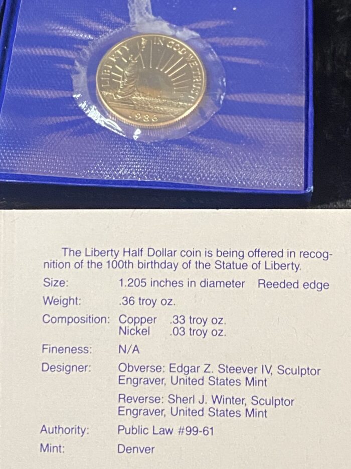 Liberty Half Dollar coin with informational card.