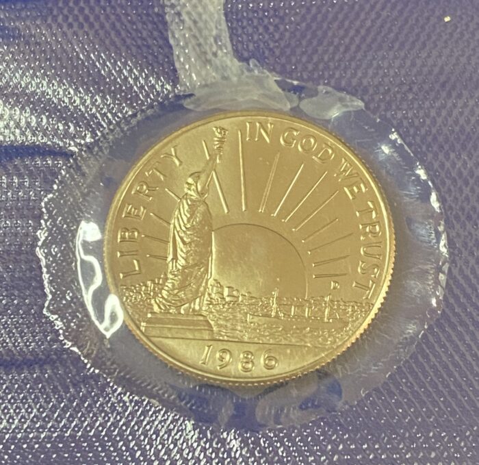 1986 gold coin with Statue of Liberty engraving