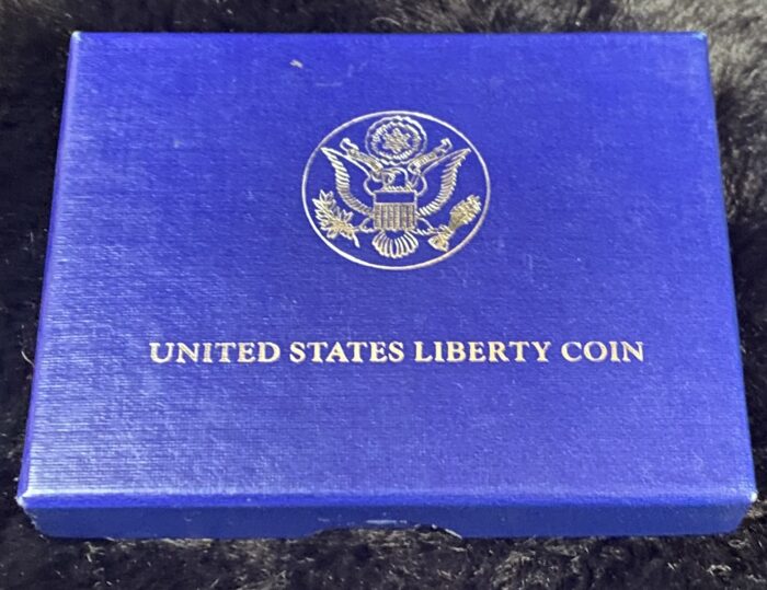 Blue box with United States Liberty Coin logo