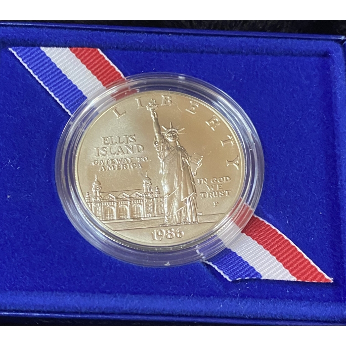 1986 Ellis Island commemorative coin with Liberty statue.