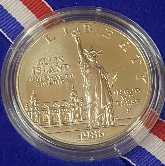 1986 Ellis Island commemorative coin with Statue of Liberty.