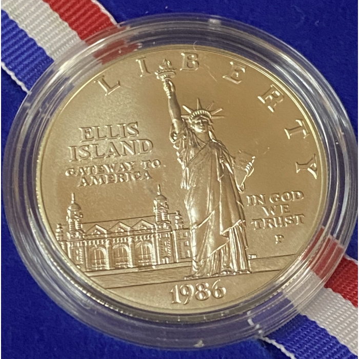 1986 Ellis Island commemorative coin with Statue of Liberty.