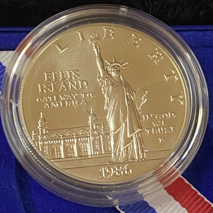 1986 Ellis Island commemorative coin with Statue of Liberty.