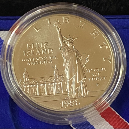 1986 Ellis Island commemorative coin with Statue of Liberty.