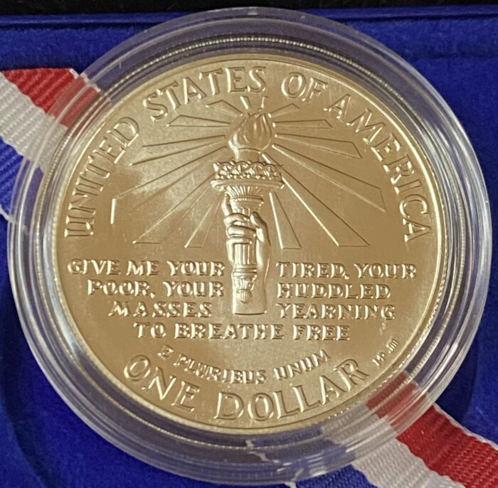 Reverse of 1986 Statue of Liberty commemorative dollar coin.