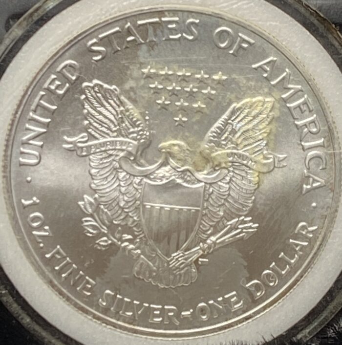 Silver American coin with eagle emblem.