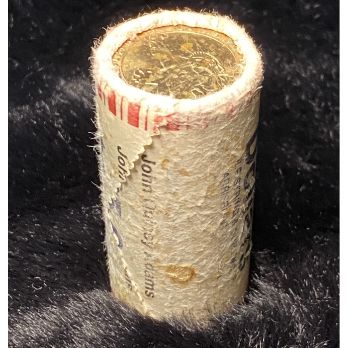 Rolled coins on black background