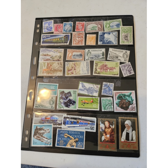 Collection of international postage stamps in album.