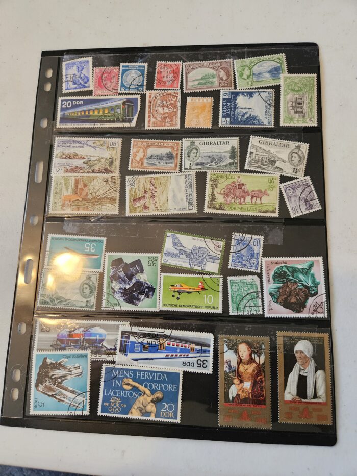 Collection of international postage stamps in album.