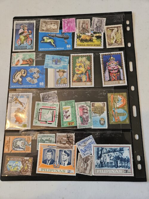 Collection of international postage stamps in a binder.