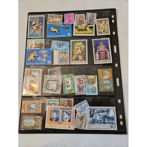 Collection of international postage stamps in a binder.