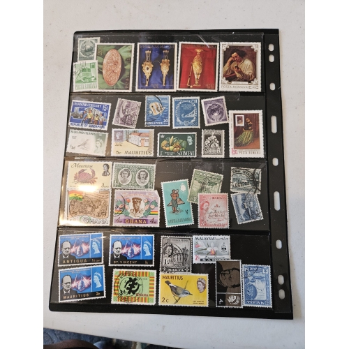 Collection of international postage stamps in an album.