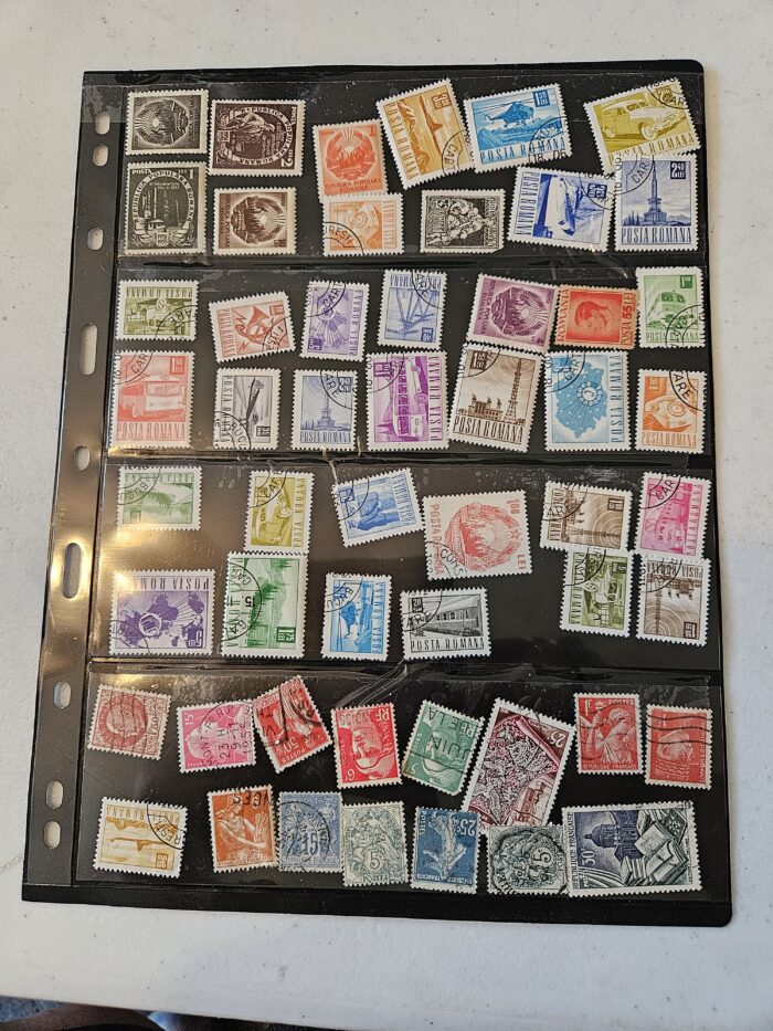 Collection of vintage postage stamps in album display.