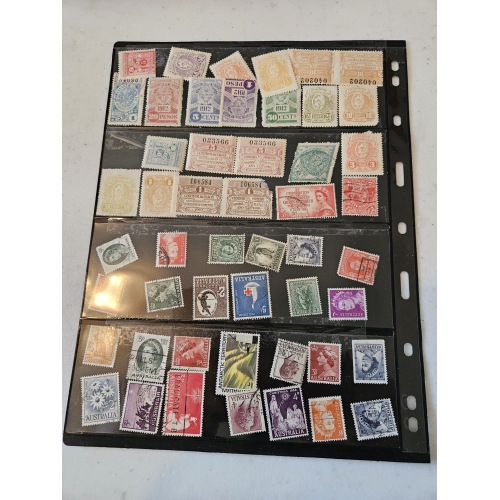 Vintage postal stamp collection in a black album.