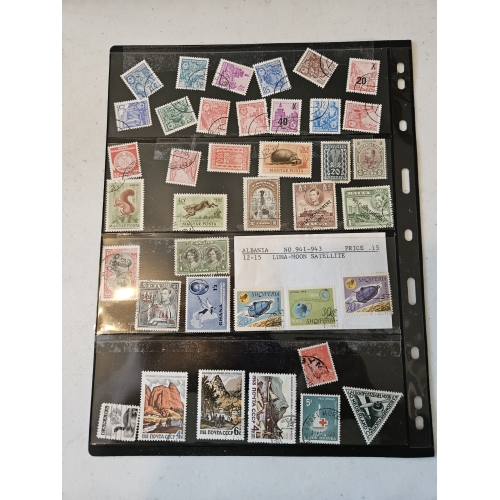 Collection of international vintage postage stamps in binder.