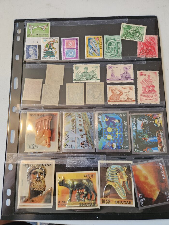 Collection of international vintage postage stamps in album.