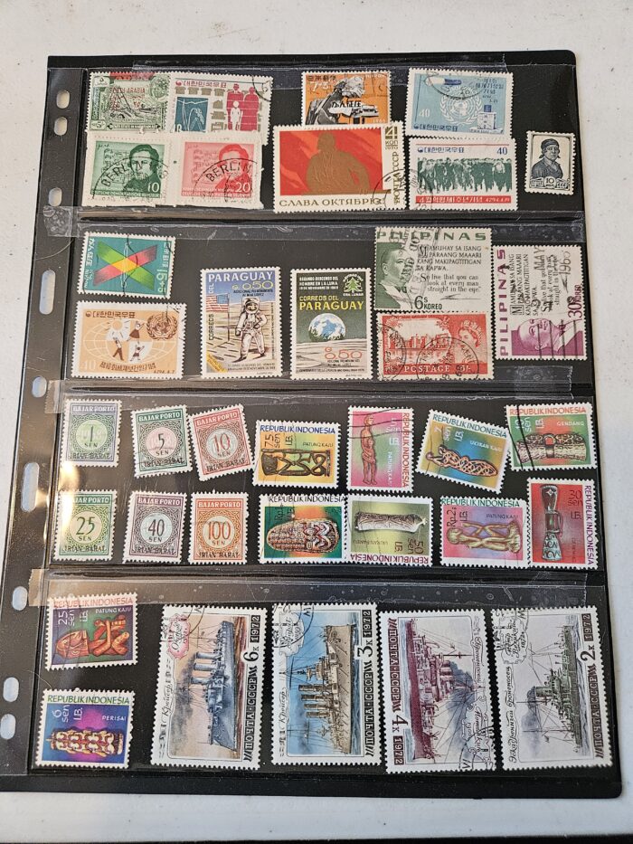 Collection of international postage stamps in an album.