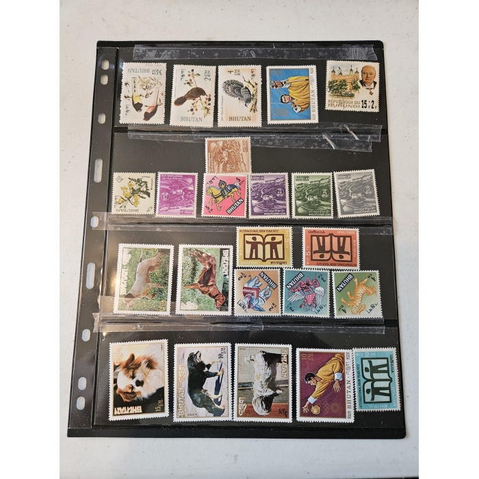 Collection of Bhutanese postage stamps in album page.