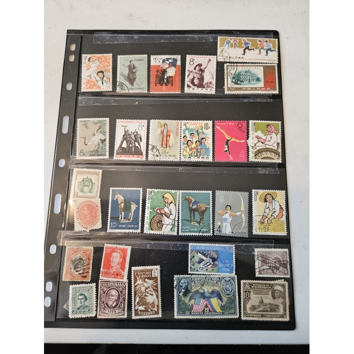 Collection of diverse international postage stamps in album.