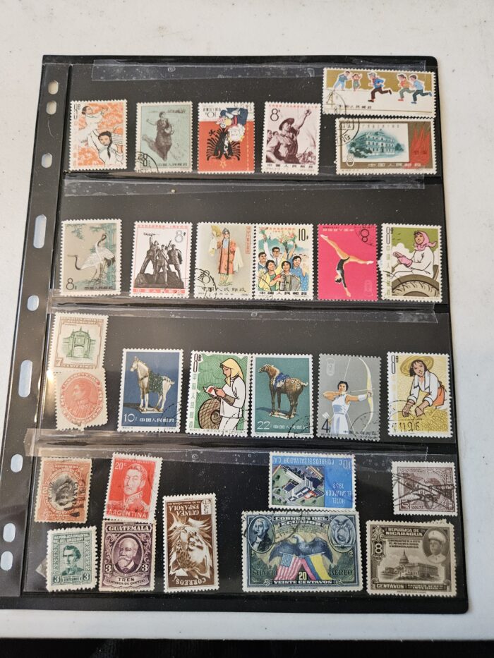 Collection of diverse international postage stamps in album.