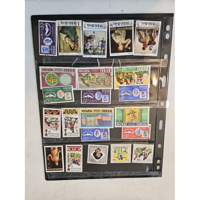 Collection of vintage international postage stamps in album.