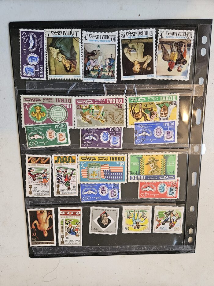 Collection of vintage international postage stamps in album.