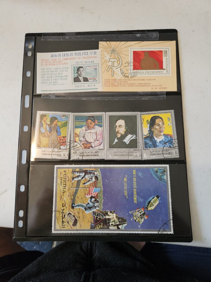 Collection of international commemorative postage stamps.