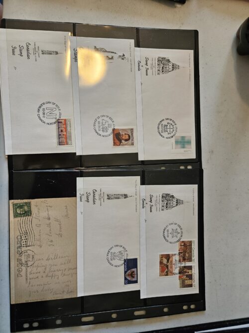 Collection of vintage postcards and stamped envelopes